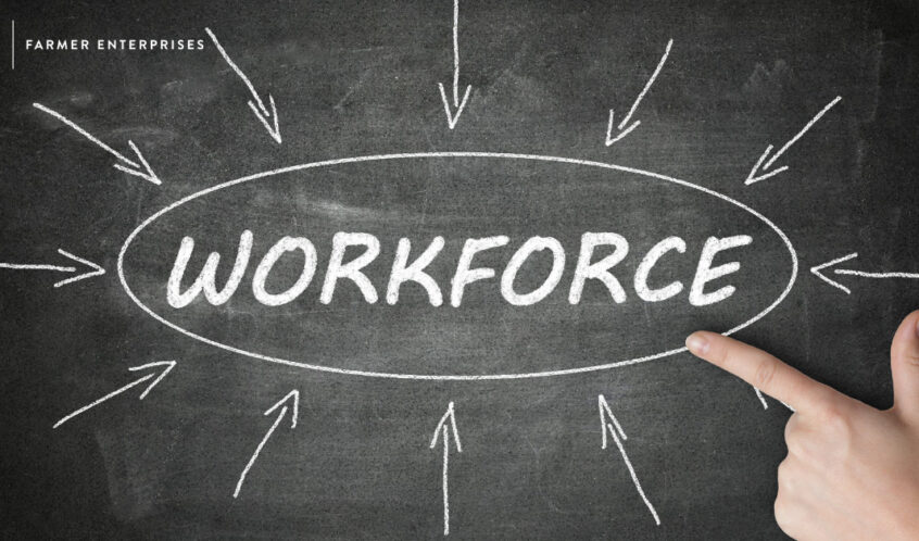 black chalkboard with white lettering that says workforce with a hand pointing at the word